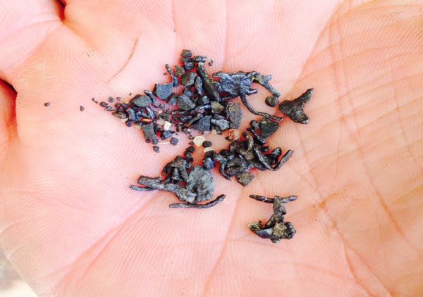 Image of lead particles held in hand
